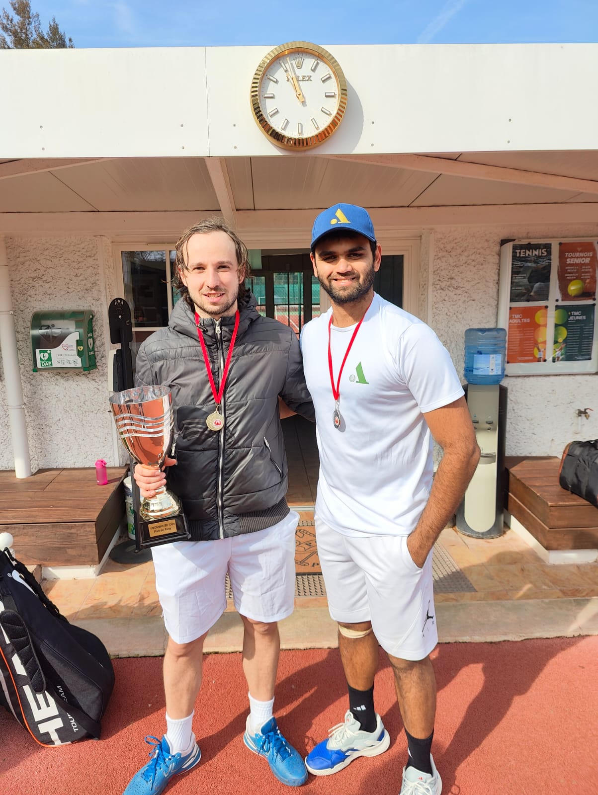Manvir with a fellow player and trophy after a tournament